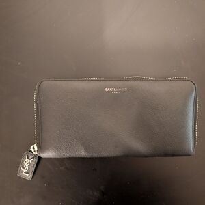 SAINT LAURENT PARIS zip around wallet in grain de poudre embossed leather BLACK